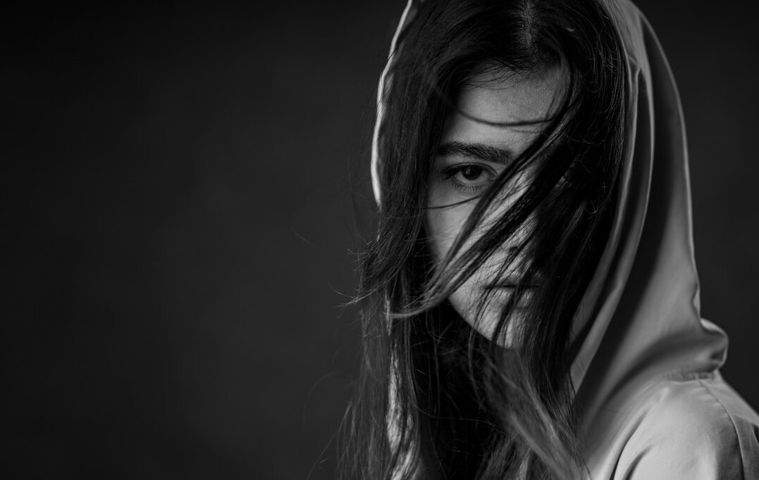 Portrait of a young woman with long hair