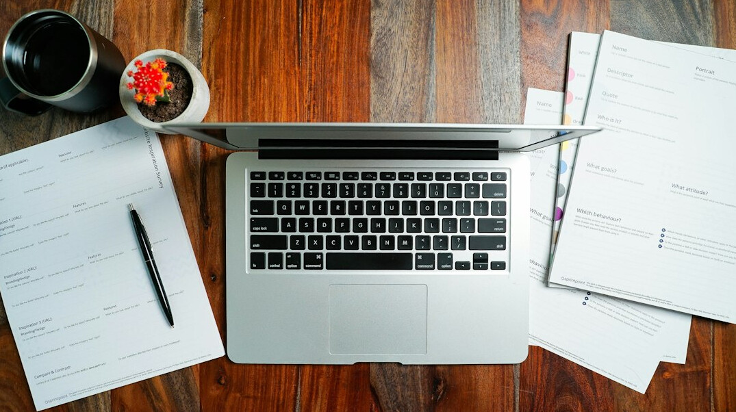 Laptop showing analytics charts on a desk